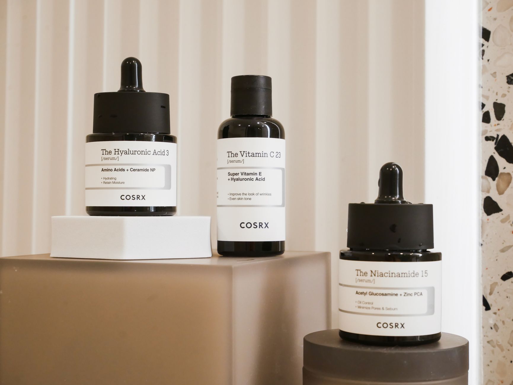 Elegant display of COSRX skincare bottles on a modern backdrop. Perfect for beauty and wellness content.